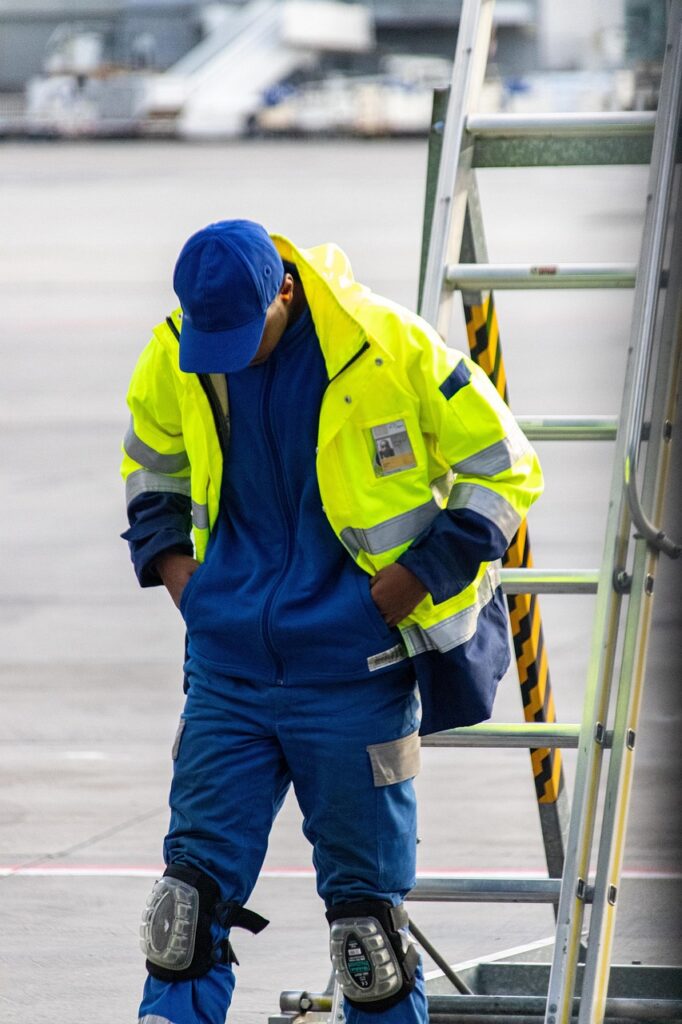 vehicle, man, safety, blue-collar worker, clothing, high-visibility clothing, person, people, construction worker, helmet, financial security, workwear, hardhat, industry, personal protective equipment, coat, gloves, outerwear, pants, adult, worker, machinery, face, outdoors, construction, workwear, workwear, workwear, workwear, workwear